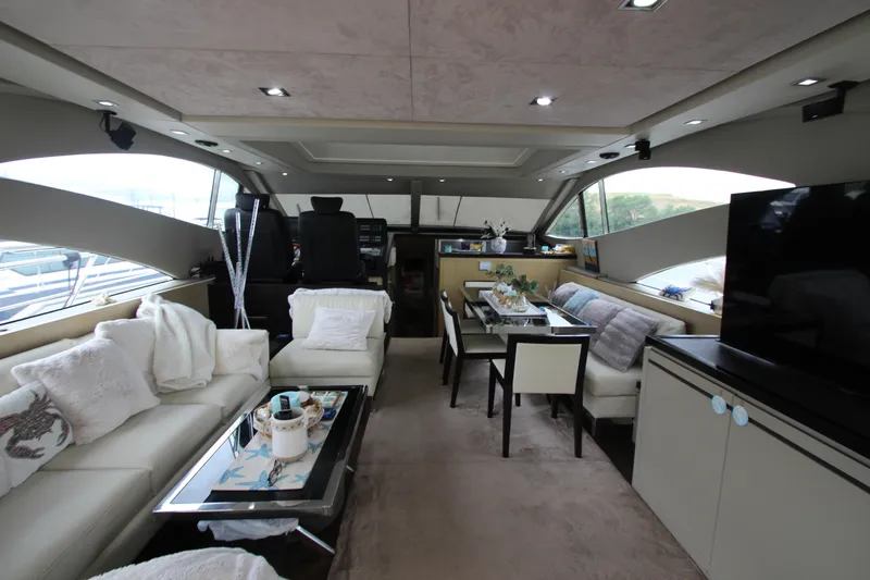  Yacht Photos Pics Luxurious interior of 2007 Uniesse 70 Sport yacht with modern furnishings.