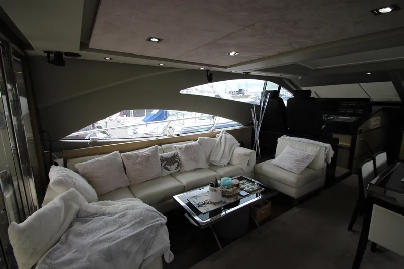  Yacht Photos Pics Luxurious interior of 2007 Uniesse 70 Sport yacht with plush seating and modern design.