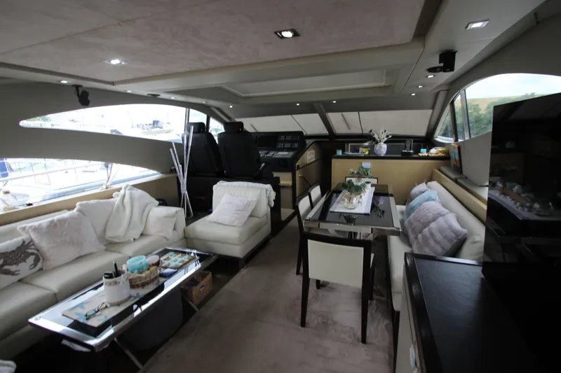 Yacht Photos Pics Luxurious interior of 2007 Uniesse 70 Sport yacht with modern furnishings.