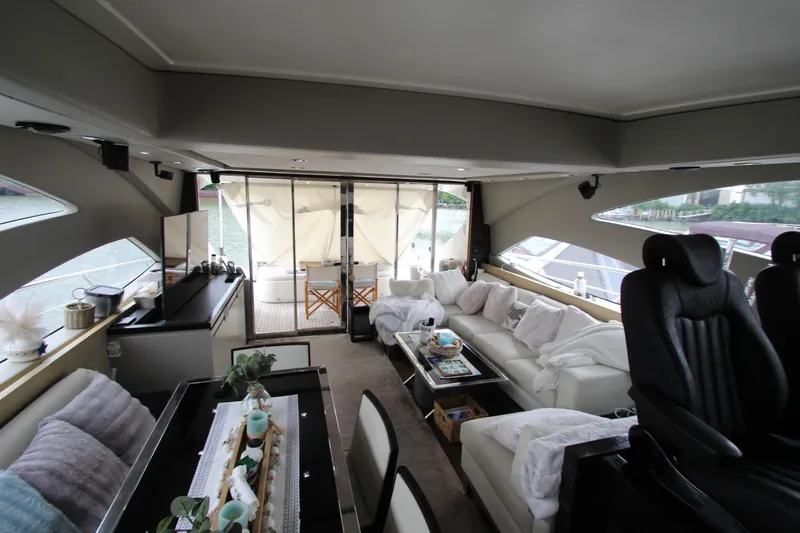  Yacht Photos Pics Luxurious interior of 2007 Uniesse 70 Sport yacht with modern seating and decor.