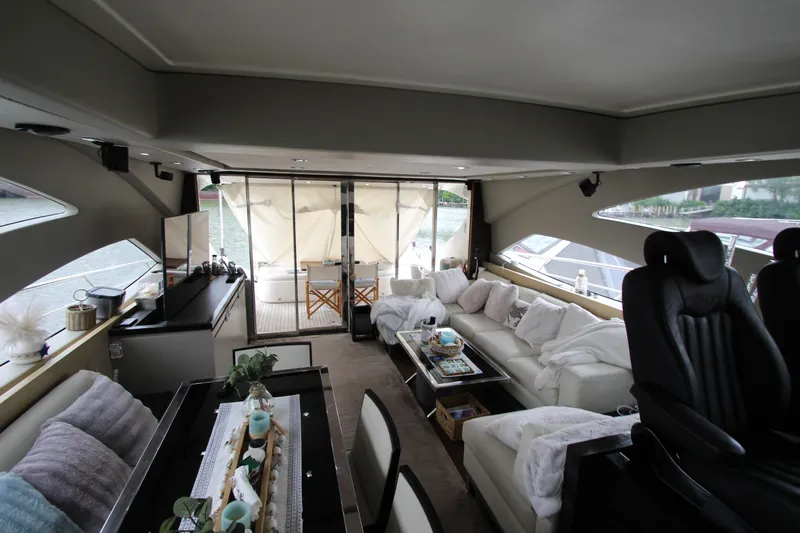  Yacht Photos Pics Luxurious interior of 2007 Uniesse 70 Sport yacht with modern seating and decor.