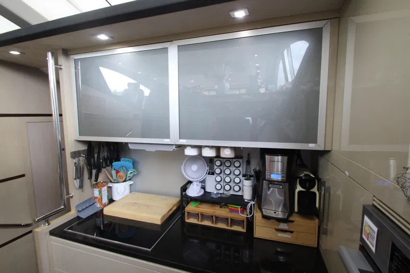  Yacht Photos Pics Modern kitchen in 2007 Uniesse 70 Sport yacht with sleek cabinetry and appliances.