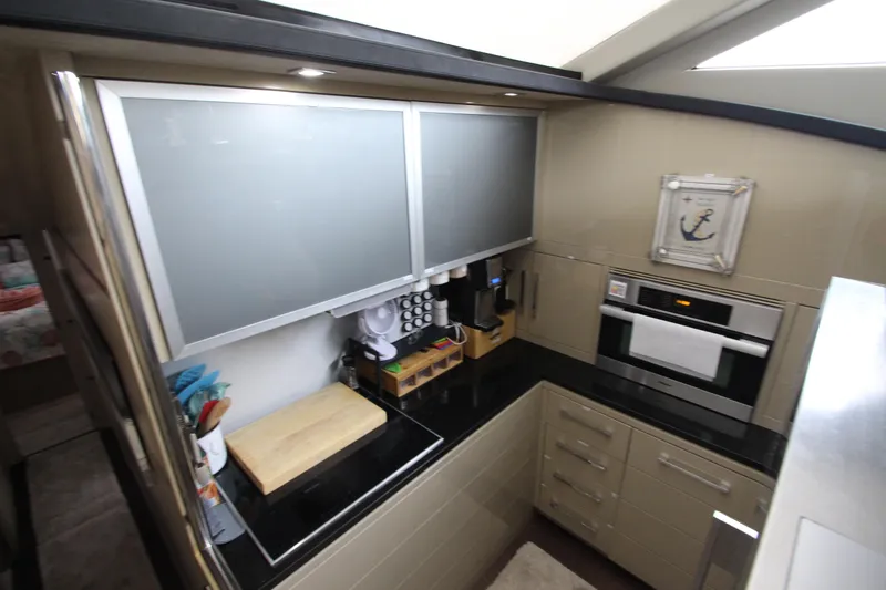  Yacht Photos Pics Modern kitchen in 2007 Uniesse 70 Sport yacht with sleek cabinetry and appliances.