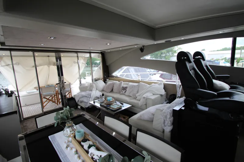  Yacht Photos Pics Luxurious interior of 2007 Uniesse 70 Sport yacht with modern seating and decor.