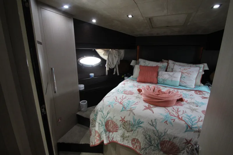  Yacht Photos Pics Luxurious bedroom in 2007 Uniesse 70 Sport yacht with ocean-themed bedding.