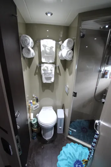  Yacht Photos Pics Luxurious bathroom in 2007 Uniesse 70 Sport yacht with modern amenities and elegant design.