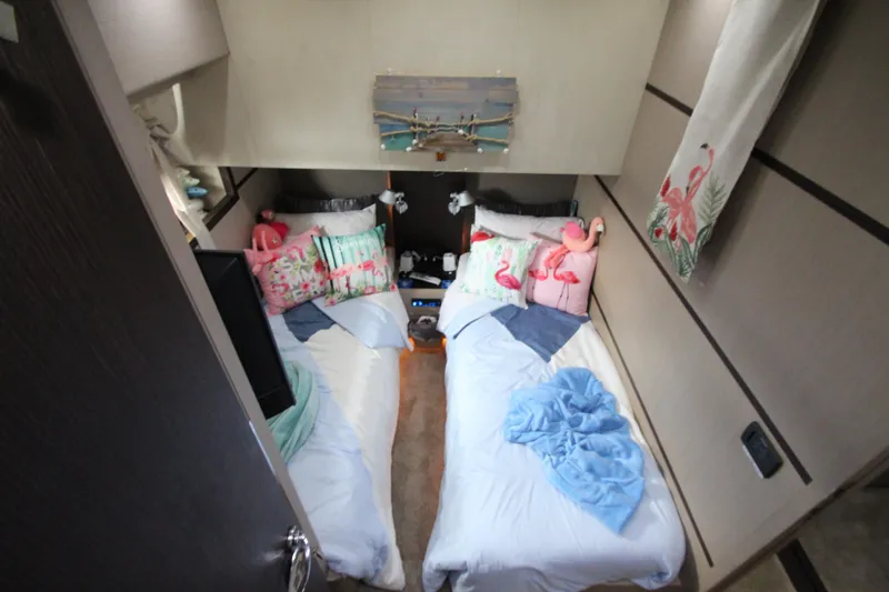  Yacht Photos Pics Twin beds with flamingo decor in 2007 Uniesse 70 Sport yacht cabin.