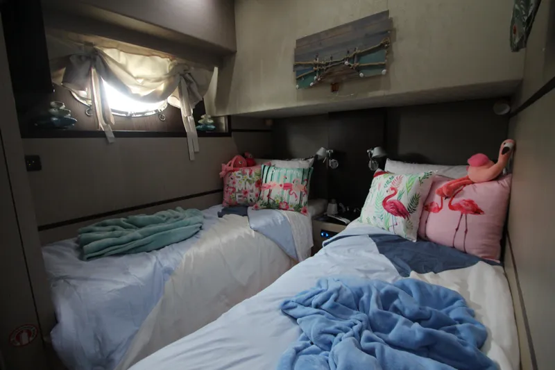  Yacht Photos Pics Cozy twin bedroom in 2007 Uniesse 70 Sport yacht with nautical decor.