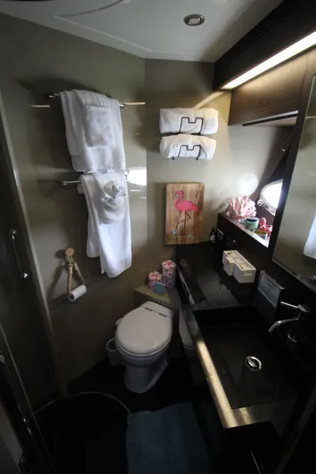  Yacht Photos Pics Luxurious bathroom in 2007 Uniesse 70 Sport yacht with modern amenities and elegant decor.