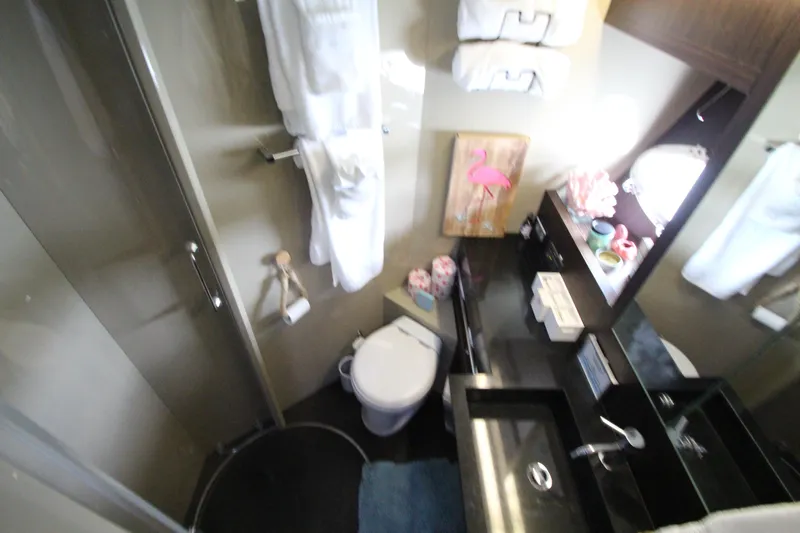  Yacht Photos Pics Luxurious bathroom in 2007 Uniesse 70 Sport yacht with modern amenities.