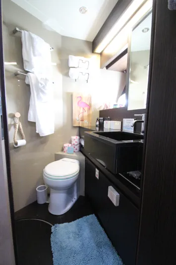  Yacht Photos Pics Luxury bathroom in 2007 Uniesse 70 Sport yacht with modern fixtures and decor.