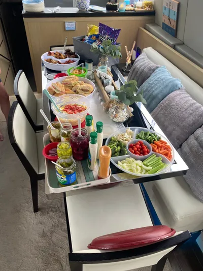  Yacht Photos Pics Buffet spread on Uniesse 70 Sport yacht, featuring snacks and condiments, 2007 model.