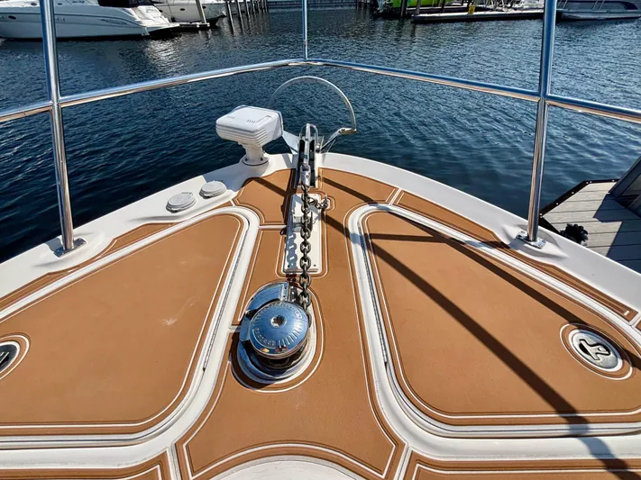 Yacht Photos Pics Bow of 2008 Sea Ray 44 Sedan Bridge with anchor and railing, docked at marina.