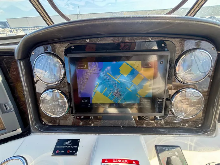  Yacht Photos Pics Dashboard of 2008 Sea Ray 44 Sedan Bridge with navigation display and gauges.