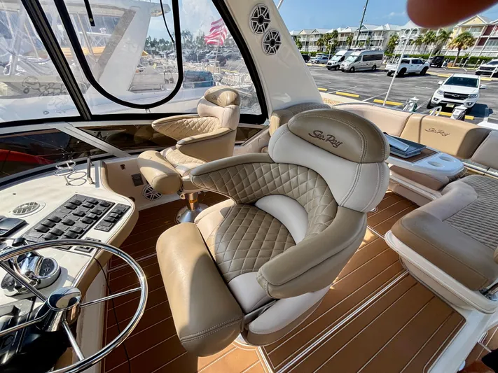  Yacht Photos Pics Luxurious helm seating on 2008 Sea Ray 44 Sedan Bridge yacht, featuring plush leather upholstery.