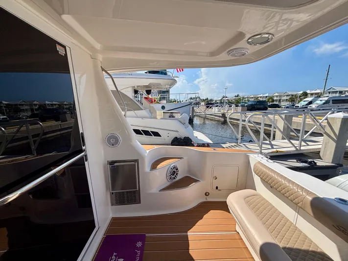  Yacht Photos Pics 2008 Sea Ray 44 Sedan Bridge yacht interior, featuring seating and dock view.