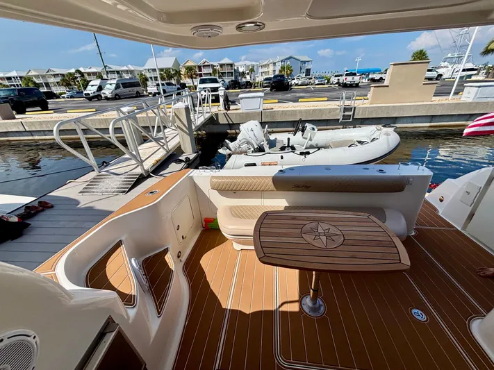  Yacht Photos Pics 2008 Sea Ray 44 Sedan Bridge yacht interior with docked inflatable boat.