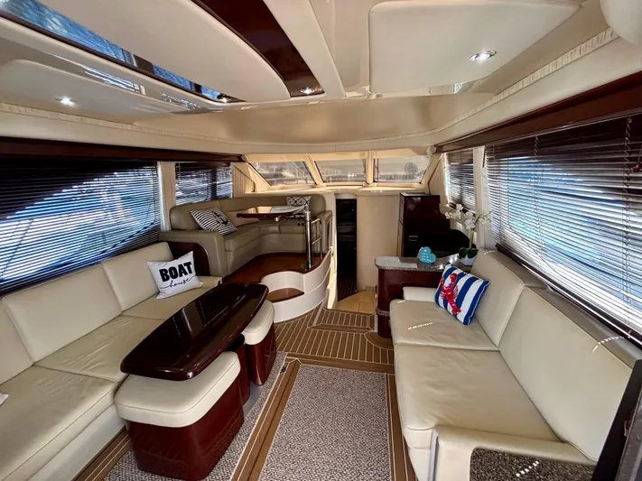  Yacht Photos Pics Luxurious interior of 2008 Sea Ray 44 Sedan Bridge yacht with elegant seating and decor.