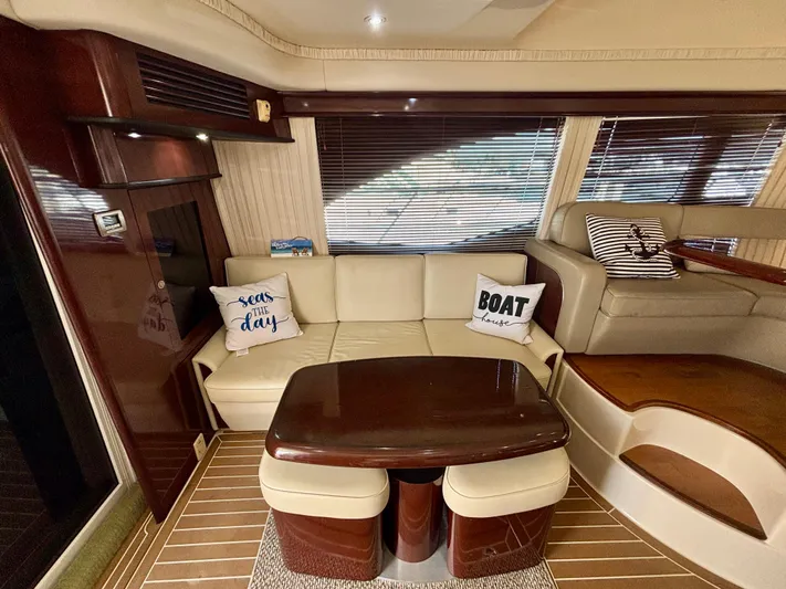  Yacht Photos Pics Interior of 2008 Sea Ray 44 Sedan Bridge with beige seating and decorative pillows.