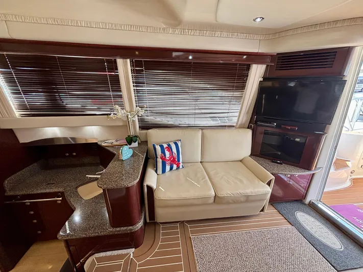  Yacht Photos Pics Luxurious interior of 2008 Sea Ray 44 Sedan Bridge with beige sofa and modern decor.