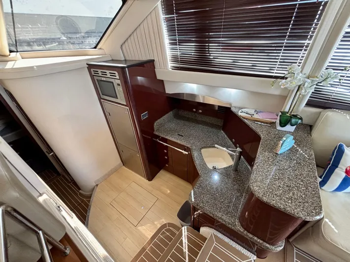  Yacht Photos Pics Luxurious kitchen area in 2008 Sea Ray 44 Sedan Bridge yacht with granite countertops.