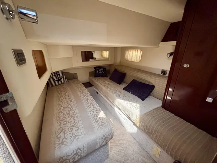  Yacht Photos Pics Interior cabin of 2008 Sea Ray 44 Sedan Bridge with twin beds and cozy decor.