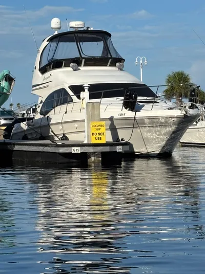  Yacht Photos Pics 2008 Sea Ray 44 Sedan Bridge yacht docked at marina with "Occupied Slip" sign.