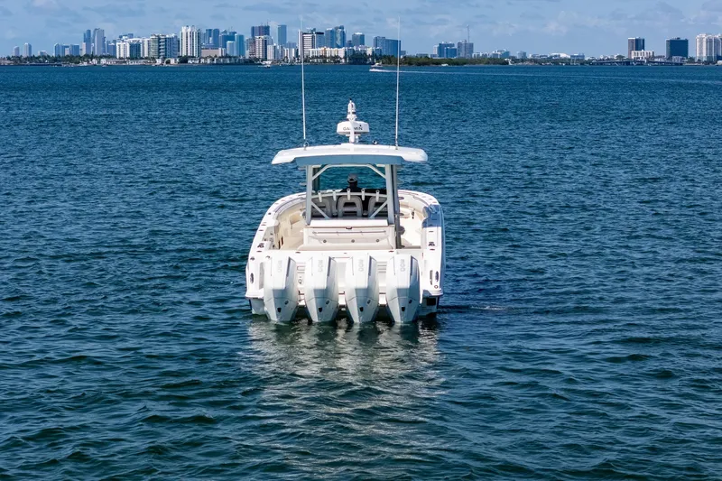 Yacht Photos Pics 2022 Boston Whaler 380 Outrage on water with city skyline in background.