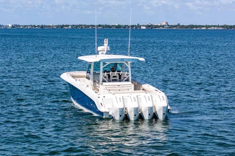  Yacht Photos Pics 2022 Boston Whaler 380 Outrage boat on open water, featuring four powerful engines.