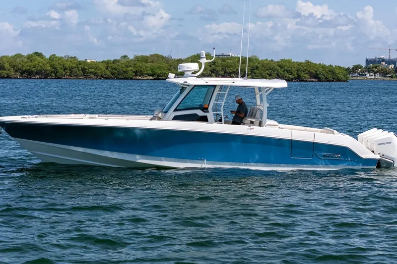  Yacht Photos Pics 2022 Boston Whaler 380 Outrage boat cruising on a sunny day.