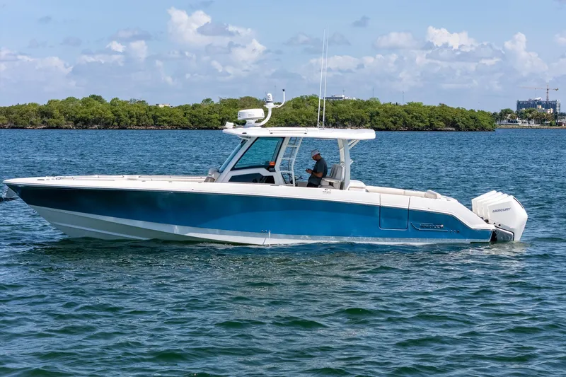  Yacht Photos Pics 2022 Boston Whaler 380 Outrage boat cruising on a sunny day.