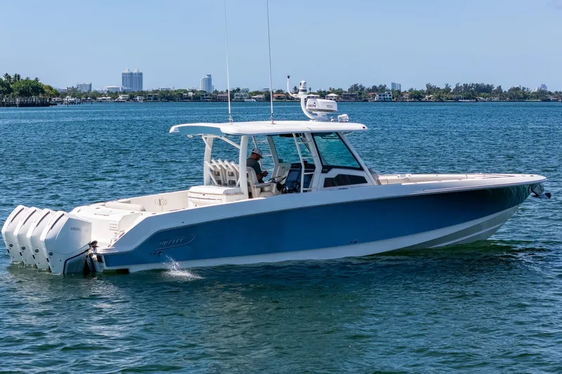  Yacht Photos Pics 2022 Boston Whaler 380 Outrage boat cruising on a sunny day.