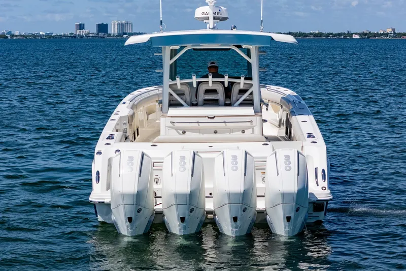  Yacht Photos Pics 2022 Boston Whaler 380 Outrage with quad engines cruising on open water.