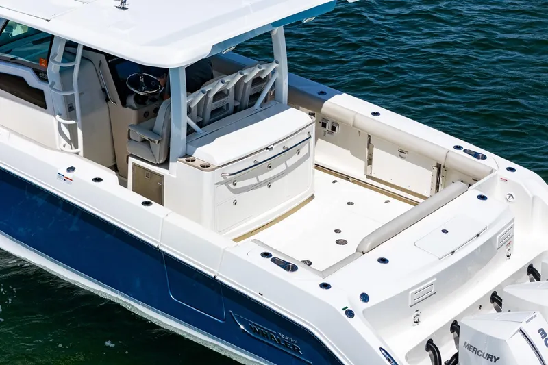  Yacht Photos Pics 2022 Boston Whaler 380 Outrage boat, featuring spacious deck and modern design on water.