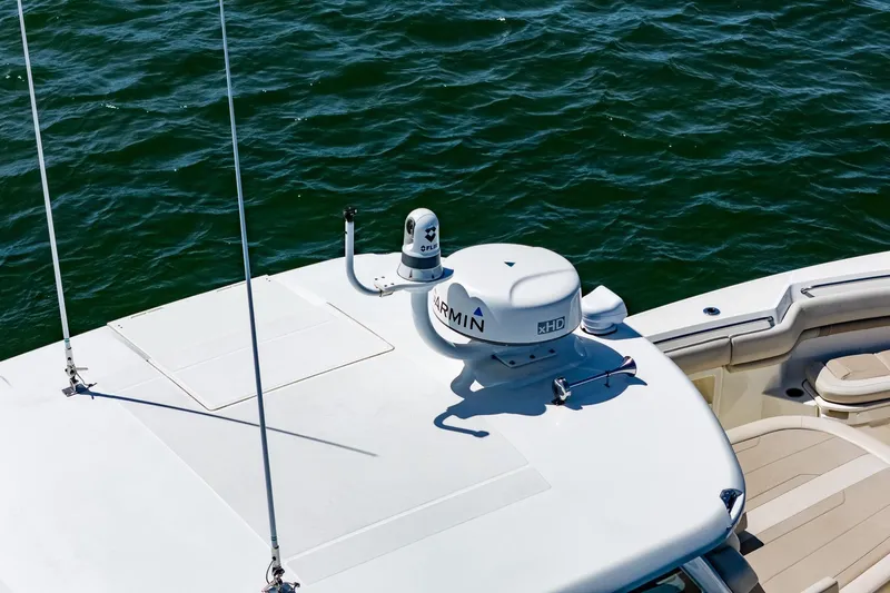  Yacht Photos Pics 2022 Boston Whaler 380 Outrage boat with Garmin radar on open water.