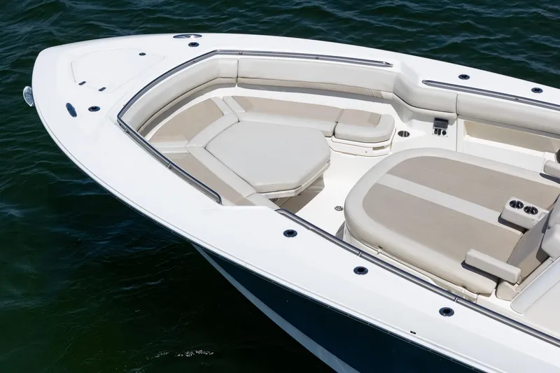  Yacht Photos Pics 2022 Boston Whaler 380 Outrage boat with spacious seating on calm water.