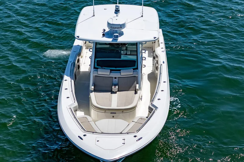 Yacht Photos Pics 2022 Boston Whaler 380 Outrage boat cruising on open water, aerial view.