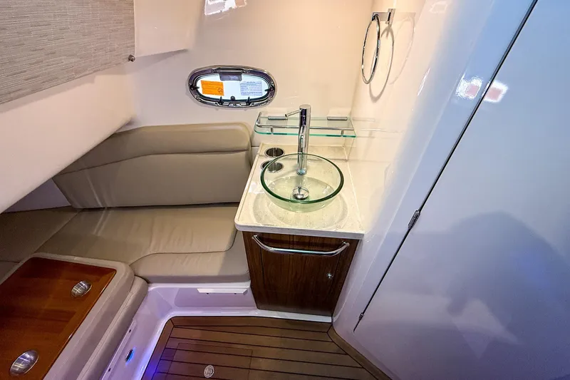  Yacht Photos Pics Luxurious interior of 2022 Boston Whaler 380 Outrage with modern sink and seating.