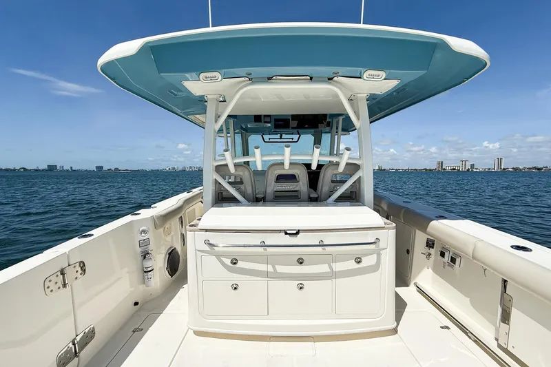  Yacht Photos Pics 2022 Boston Whaler 380 Outrage boat interior with ocean view and city skyline.
