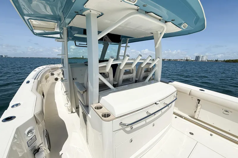  Yacht Photos Pics 2022 Boston Whaler 380 Outrage boat on water, featuring spacious deck and seating.