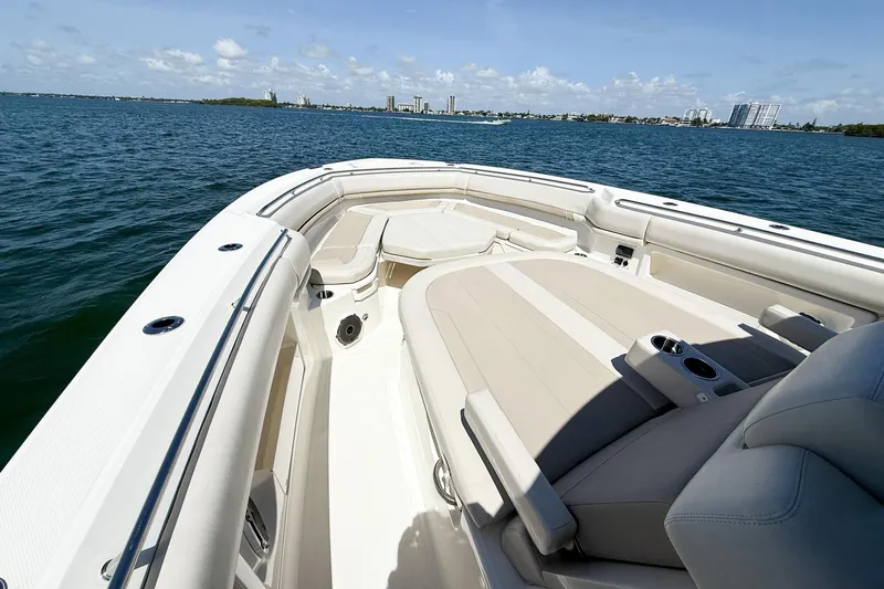  Yacht Photos Pics 2022 Boston Whaler 380 Outrage boat interior with luxurious seating on open water.