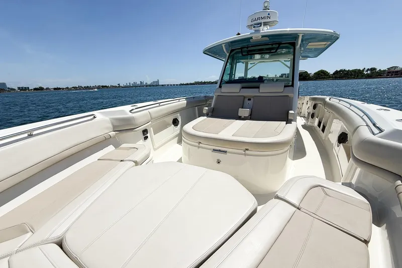  Yacht Photos Pics 2022 Boston Whaler 380 Outrage boat interior with luxurious seating on open water.