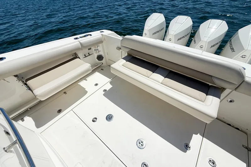  Yacht Photos Pics 2022 Boston Whaler 380 Outrage boat deck with seating and Mercury engines.