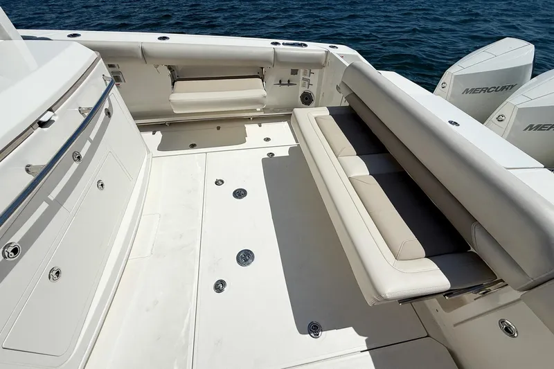  Yacht Photos Pics 2022 Boston Whaler 380 Outrage boat interior with seating and Mercury engines.