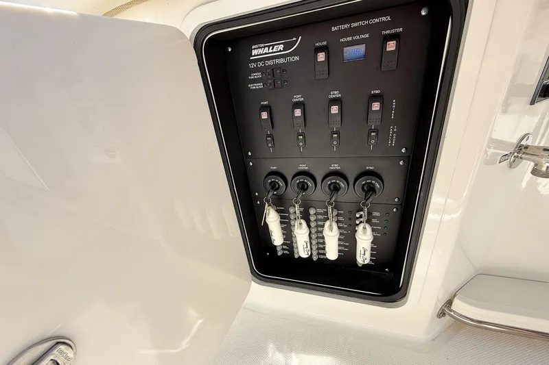  Yacht Photos Pics 2022 Boston Whaler 380 Outrage electrical panel with switches and controls.