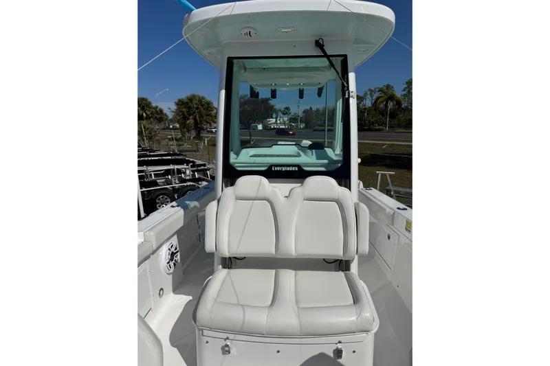  Yacht Photos Pics 2024 Everglades 235 Center Console boat interior with white seating and console view.