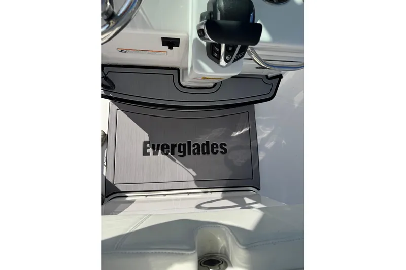  Yacht Photos Pics 2024 Everglades 235 Center Console boat interior with branded flooring.