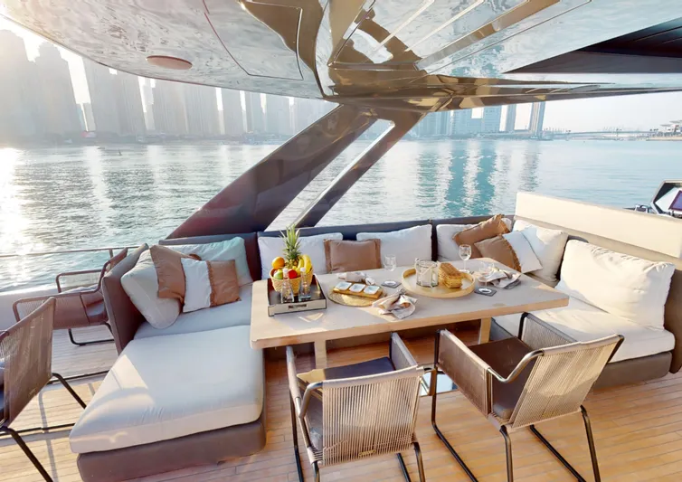  Yacht Photos Pics Luxurious 2019 Ferretti Yachts 780 deck with elegant seating and waterfront view.