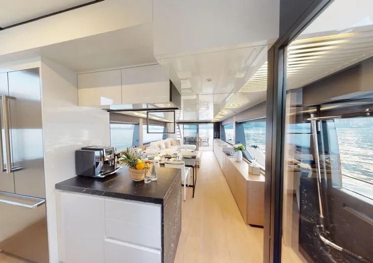  Yacht Photos Pics Luxurious interior of 2019 Ferretti Yachts 780, featuring modern kitchen and spacious seating area.