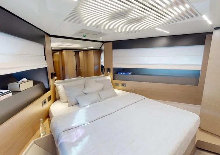  Yacht Photos Pics Luxurious bedroom interior of 2019 Ferretti Yachts 780 with modern design and elegant furnishings.